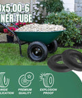 Two 13x5.00-6 Inner Tubes With Straight Valve Stem next to a wheelbarrow filled with stones on grass lawn.
