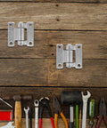Heavy Duty Stainless Steel Cargo Door Hinges For Automotive Use, Welded Construction With Screws, Noise Minimizing Design, Silver Finish For Exterior Vehicle Doors, Built Tough For Trucks And Trailers on wood