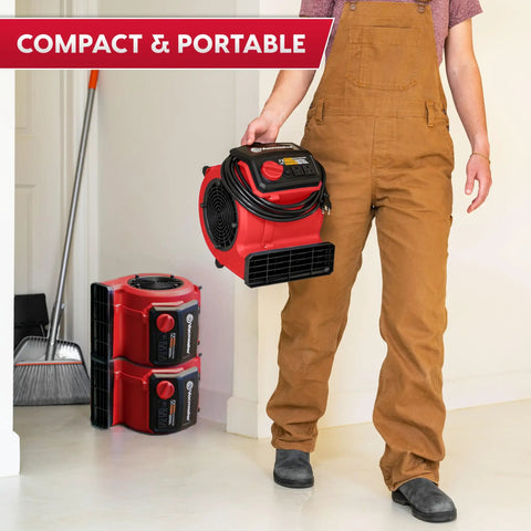 Person holding Heavy Duty Three Speed Floor Fan with 156W 550 CFM air mover, showcasing compact and portable design.