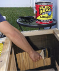 Applying Liquid Rubber Sealant Coating for Waterproof, Flexible Protection on Wood Surface using Brush, 1 Gallon Can in View