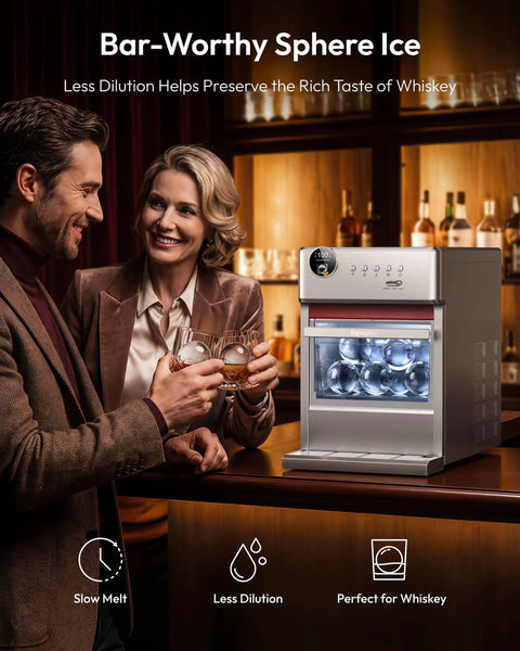 Elite Countertop Clear Ice Ball Maker Featuring Smart App Control And Reliable WiFi Connectivity Plus A Built In Twenty Four Hour Timer, couple enjoying whiskey with clear ice spheres.