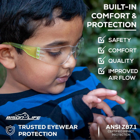 Assorted Color Kids Safety Glasses 12 Pack Over Glasses Design With Ansi Z87 Rating For Youth providing soft TR90 frames on a child.