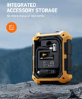 Back view of 12V DC Portable Tire Inflator With LED Light And Digital Gauge showing integrated accessory storage on rocky surface.