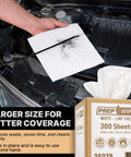 Hand holding Prep Wipe White Lint Free Cleaning Towels 300 Sheets 10 by 14 Inches near car engine with towel box in view