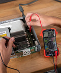 Auto-Ranging Digital Multimeter For Automotive And Home Electrical Troubleshooting UL Certified in use on circuit board
