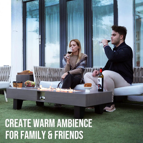 Outdoor setup with a 54 Inch Propane Fire Pit Table With Rain Cover For Outdoor Patio Backyard Or Deck 50 000 BTU Gas Heater Rectangular Modern Wood Look Fire Pit Durable Stainless Steel Burner Bowl Effortless Setup And Use.