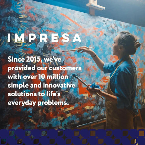 Person painting a large abstract canvas with text highlighting 10 million solutions by Impresa since 2015.