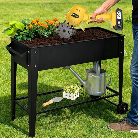Person using Cordless 20V Tiller Cultivator For Gardening in elevated planter with flowers, ergonomic grip, 240 RPM power.