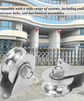 U Groove Gate Track Roller Set With Stainless Steel Construction Heavy Duty Sliding Gate Wheels displayed outdoors with building.