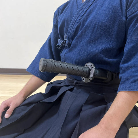Polypropylene Short Practice Samurai Training Sword 24-Inch With Black Saya Scabbard worn by martial artist