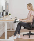 Under Desk Keyboard Tray 25 Inch With Wrist Rest Mouse Pad Cup Mat Lightweight Slide Out Tray Easy Clamp Adjustable For Ergonomic Desk Setup And Clutter Free Workstation Plug And Play in home office setting with woman seated at desk