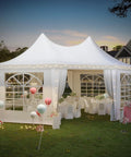 Heavy Duty Octagonal Party Tent 20x15ft With Six Removable Sidewalls, Church Windows, And Pull-Back Doors set up outdoors