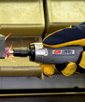 Tough As Nails Straight Pneumatic Die Grinder delivers 25000 RPM, held in a gloved hand, polishing metal with sparks flying.