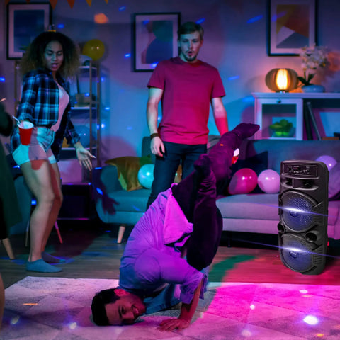 Beast 600W Peak Portable Bluetooth PA Speaker System with Dual 8 Inch Subwoofers at a lively indoor party with dancers
