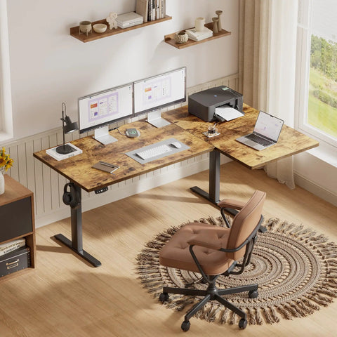 Brown 55x28 Inch Reversible L Shaped Electric Standing Desk With Height Adjustable Sit Stand Motorized Base Ergonomic Computer Corner Table For Home Office Workstation featuring dual monitors and printer.