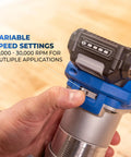 Hand adjusting the speed dial on the Slick Action 20V Cordless Trim Router Featuring Micro Adjustment Dial And Dual LED Lights.