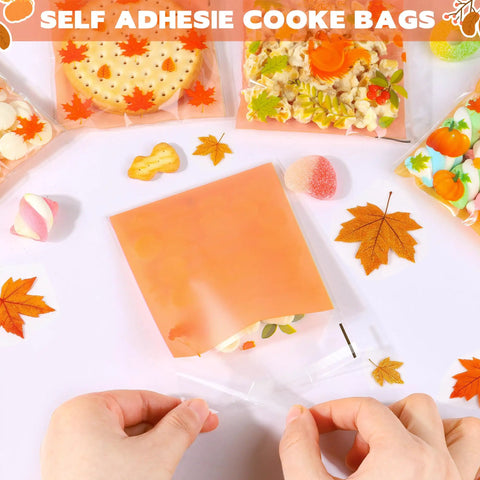 Fall Treat Bags 200 Pack, 4x4 Self Sealing Cellophane Bags with autumn leaves design being sealed, perfect for candy and snacks