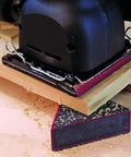 A power tool supported by Triangle Bench Cookie Work Grippers 4 Pack Non Slip Project Supports For Woodworking And Painting Elevates Projects