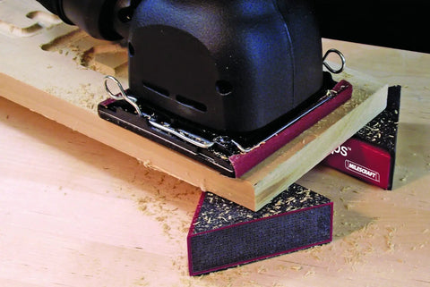 A power tool supported by Triangle Bench Cookie Work Grippers 4 Pack Non Slip Project Supports For Woodworking And Painting Elevates Projects