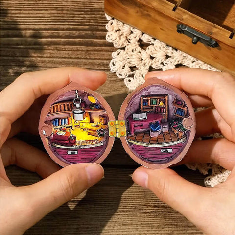 Hands holding an open miniature wooden room with a 100 Piece Tiny Dollhouse Hinges Set With 180 Degree Mini Metal Hinge Hardware.
