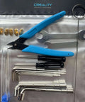Ender Series 3D Printer Tool Kit featuring clog poke, shear pliers, Allen wrench, cleaning needles, nozzles, and screwdriver