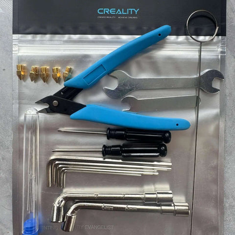 Ender Series 3D Printer Tool Kit featuring clog poke, shear pliers, Allen wrench, cleaning needles, nozzles, and screwdriver