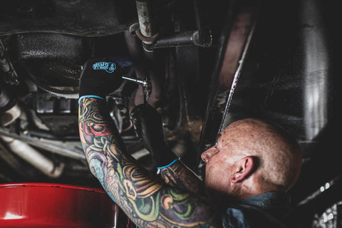 Mechanic wearing Never Slip Maximum Grip All Purpose Work Gloves For Men With Polymer Palm for wet dry oily conditions