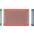 Pack of 12 Double Sided PCB Prototyping Boards for DIY Soldering Breadboard Projects, 4cm by 6cm in red, green, and blue.