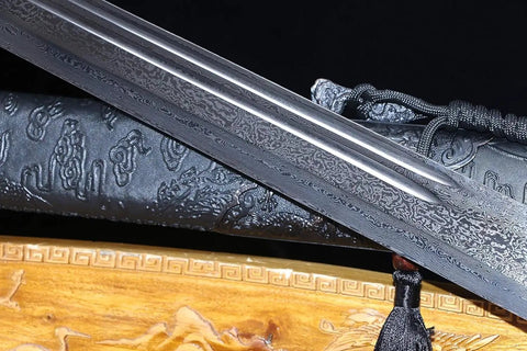 Close-up of Beefy Damascus Tang Dao Sword with black gold finish, showing traditional folding pattern and alloy fittings.