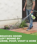 Person using a 32 oz Pet Odor Eliminator Spray For Dogs With Natural Enzymes on a patio to remove urine and vomit odors