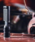 Stinger High Output LED Duty Flashlight With Piggyback Charging Kit 2000 Lumen 25000 Candela on industrial surface.