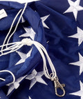 Close-up of Patriotic Windsock 40 Inch With Embroidered Stars Fade Resistant American Flag Outdoor Decor material and clasp.