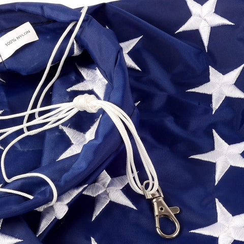 Close-up of Patriotic Windsock 40 Inch With Embroidered Stars Fade Resistant American Flag Outdoor Decor material and clasp.