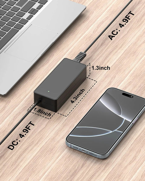 42V All In One Universal Charger For Jetson Electric Bikes And Scooters With Wide Compatibility next to laptop and phone on desk