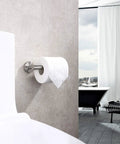Brushed Nickel Toilet Paper Holder Wall Mount In SUS304 Stainless Steel installed beside toilet with large roll visible