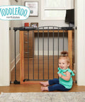 Woodgrain Steel Baby Gate With Auto Close For Doorways, Adjustable From 29.75 To 40.5 Inches Wide And 30 Inches Tall, shown in hallway with child
