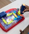 Child using drill with Space Circuits Beginner Circuit Building Kit for Kids 52 Piece STEM Toy on red and purple base