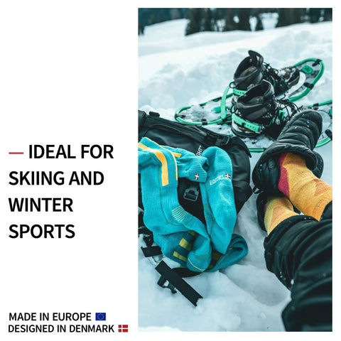 Merino Wool Performance Ski Socks For Men Women And Kids with boots and snowshoes on snowy terrain, light grey pink socks visible
