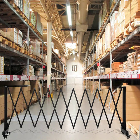 Tough 11.5 Foot Expandable Barricade Gate And Retractable Metal Crowd Control Fence With Smooth Rollin Wheels in warehouse aisle.