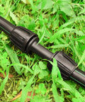 Half Inch Drip Irrigation Tubing Couplings Kit, 12 Barbed Locking Connectors for Drip Tubing, 16mm OD, in garden setting.