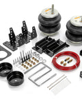 TORQUE airbag suspension kit with two rubber air springs, black steel brackets, red air hose, and mounting hardware.
