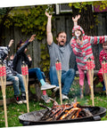 Group enjoying backyard gathering with 2 Pack Faux Bamboo Tiki Torches Outdoor Decor For Backyard Handmade Bamboo Torch Lights