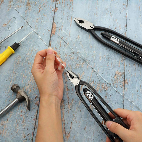 Hands using Safety Wire Pliers Set with 9 Inch and 6 Inch Pliers, 3 in 1 Wire Twisting Tool, lock wire, on wooden surface.