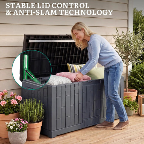 Woman placing cushions in Extra Large 120 Gallon Outdoor Storage Deck Box With No Sweat Hydraulic Lift Lid Heavy Duty All Weather Patio Organizer.