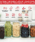 Mason Jar Vacuum Sealer Accessory Set With Cordless Hand Pump For Regular And Wide Mouth Jars filled with assorted foods.