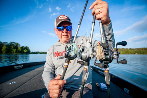 Angler on boat holding Reed Runner Tandem Spin Premium Spinner Baits For Freshwater Lures That Catch Bass Pike And Musky White Shad 3/8 Oz