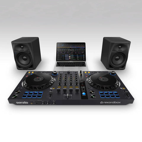 DJ setup with laptop, DJ controller, and DM 50D BT 5 Inch Desktop Monitor System With Bluetooth For DJs And Beat Makers Dual 2 Way Sound Modes