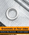 Close-up of grommet on Heavy Duty Waterproof Poly Tarpaulin 12x25 Feet Silver Black With Grommets And Reinforced Edges UV Resistant Tarp Cover