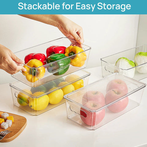 Top Shelf Eight Piece Clear Stackable Storage Bins With Slick Snap Lids Go To Fridge Organizers holding bell peppers, lemons, and apples.