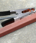 Heavy Duty Welding Ground Clamp With Copper And Iron Build Designed For Secure Earth Connection Plus Strong Load Bearing Capabilities To Keep Your Setup Safe And Steady While Getting Work Done Any Day on a wooden surface.